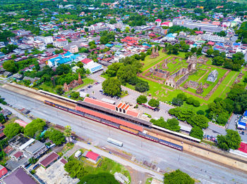 High angle view of trees and buildings in city