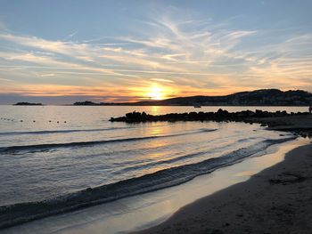 Scenic view of sea against sky during sunset