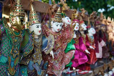 Close-up of puppets for sale