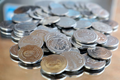 Close-up of coins on table