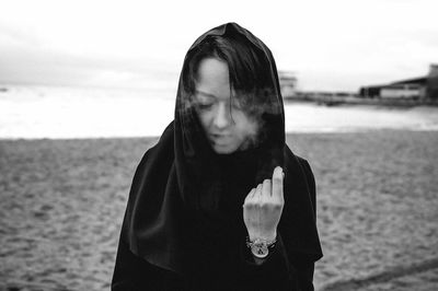 Woman standing at beach