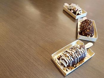 Ice creams in containers on table