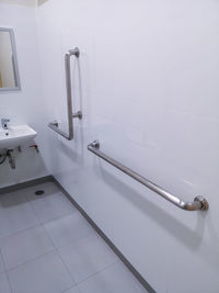 Railings mounted on wall in bathroom
