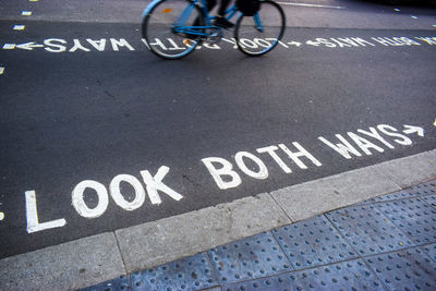 High angle view of bicycle sign on road