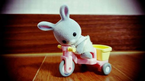 Close-up of stuffed toy on hardwood floor