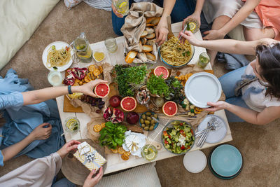 High angle view of people having food at home