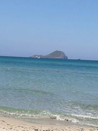 Scenic view of sea against clear blue sky