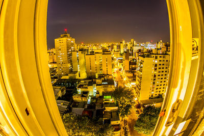 High angle view of illuminated buildings in city against sky