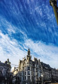 Low angle view of buildings in city against sky