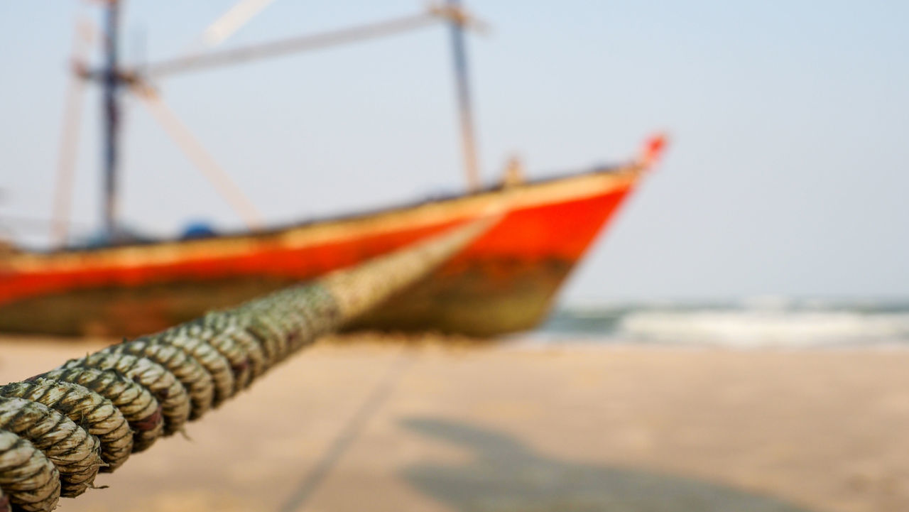 CLOSE-UP OF FISHING BOAT ON SHORE