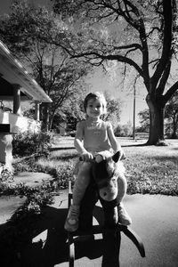 Portrait of girl on a rocking horse