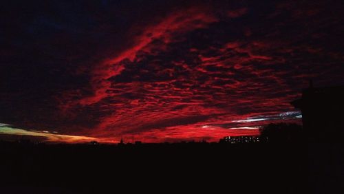 Low angle view of dramatic sky at night