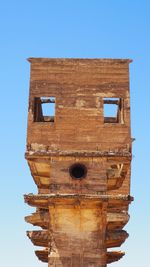 Low angle view of bell tower against clear sky