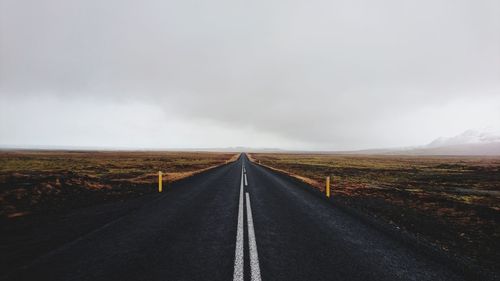 Road amidst landscape against sky