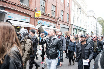 Group of people walking on city street