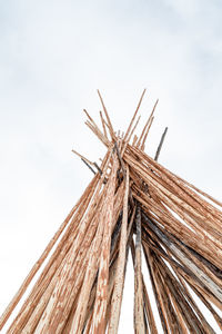 Low angle view of metallic structure against sky