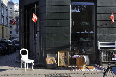 Flags on glass against buildings in city