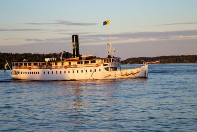 Ship moored on sea against sky