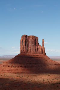 Rock formations in desert against sky