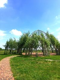 Trees on field against sky