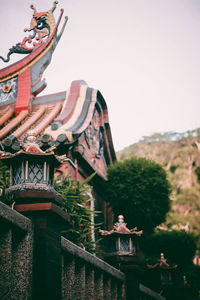 Sculpture of temple against building