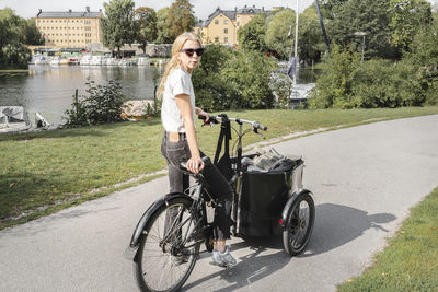 Woman cycling cargo bike