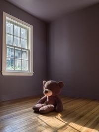 Stuffed toy on wooden floor at home