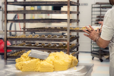 Midsection of man preparing food