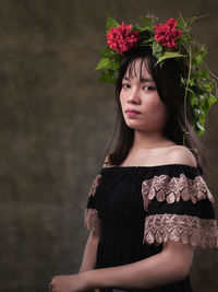 Portrait of beautiful young woman looking away