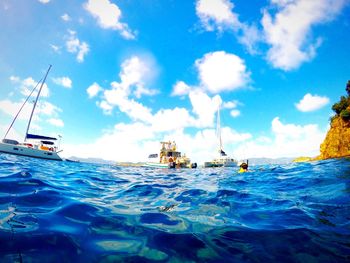 Boats sailing in sea