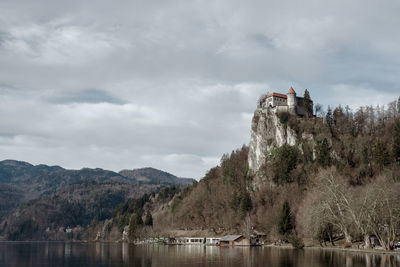 Bled castle on top of steep cliff above lake bled in slovenia