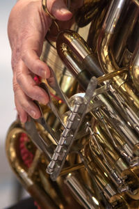 Close-up of person playing guitar