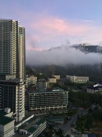 High angle view of buildings in city against sky
