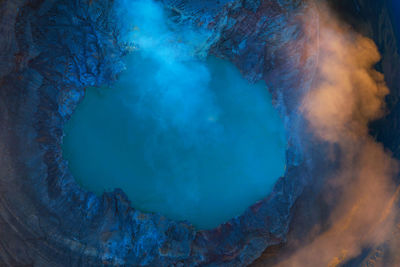 High angle view of hot spring in volcanic crater