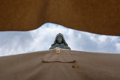 Low angle view of statue against sky