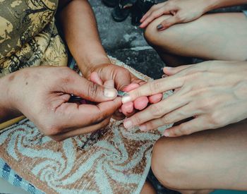 High angle view of couple holding hands