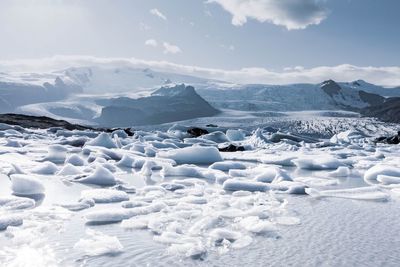 Scenic view of snowcapped mountains against sky