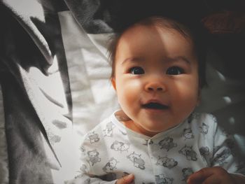 Close-up portrait of cute baby at home