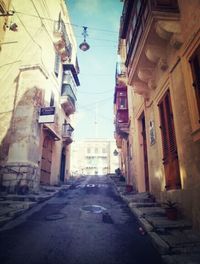 Narrow alley along buildings