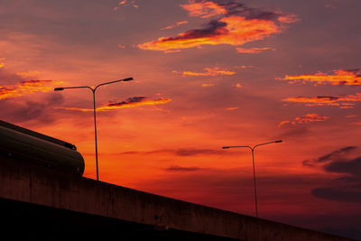 Bottom view of elevated concrete highway with sunset sky. overpass concrete road. road flyover.