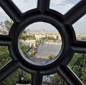 View of buildings seen through from window