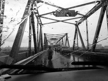 View of bridge against cloudy sky