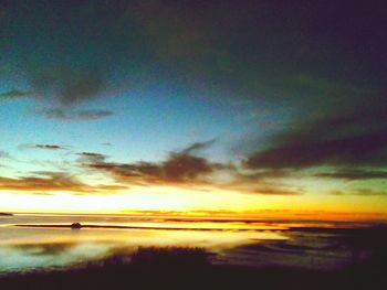 Scenic view of sea at sunset