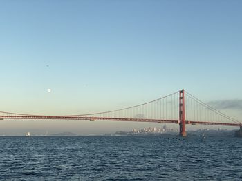 View of suspension bridge over sea