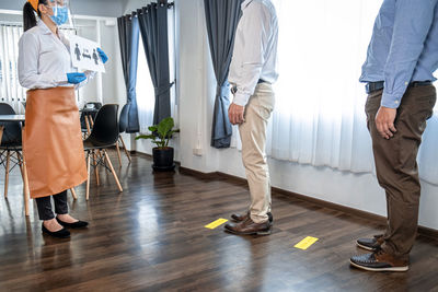 Low section of doctors standing in gym