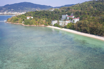 Scenic view of sea by mountain