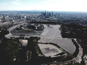 High angle view of city buildings against sky