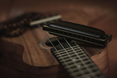 High angle view of guitar on table