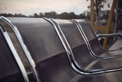 Close-up of empty seats in rack