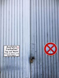 Close-up of warning sign on wood